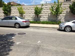 Unacceptable. If you can't parallel park in a reasonable distance, don't drive.